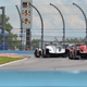 Mustang Sampling Racing Cadillac DPi leads the Mazda Motorsports Mazda DPi through the chicane
